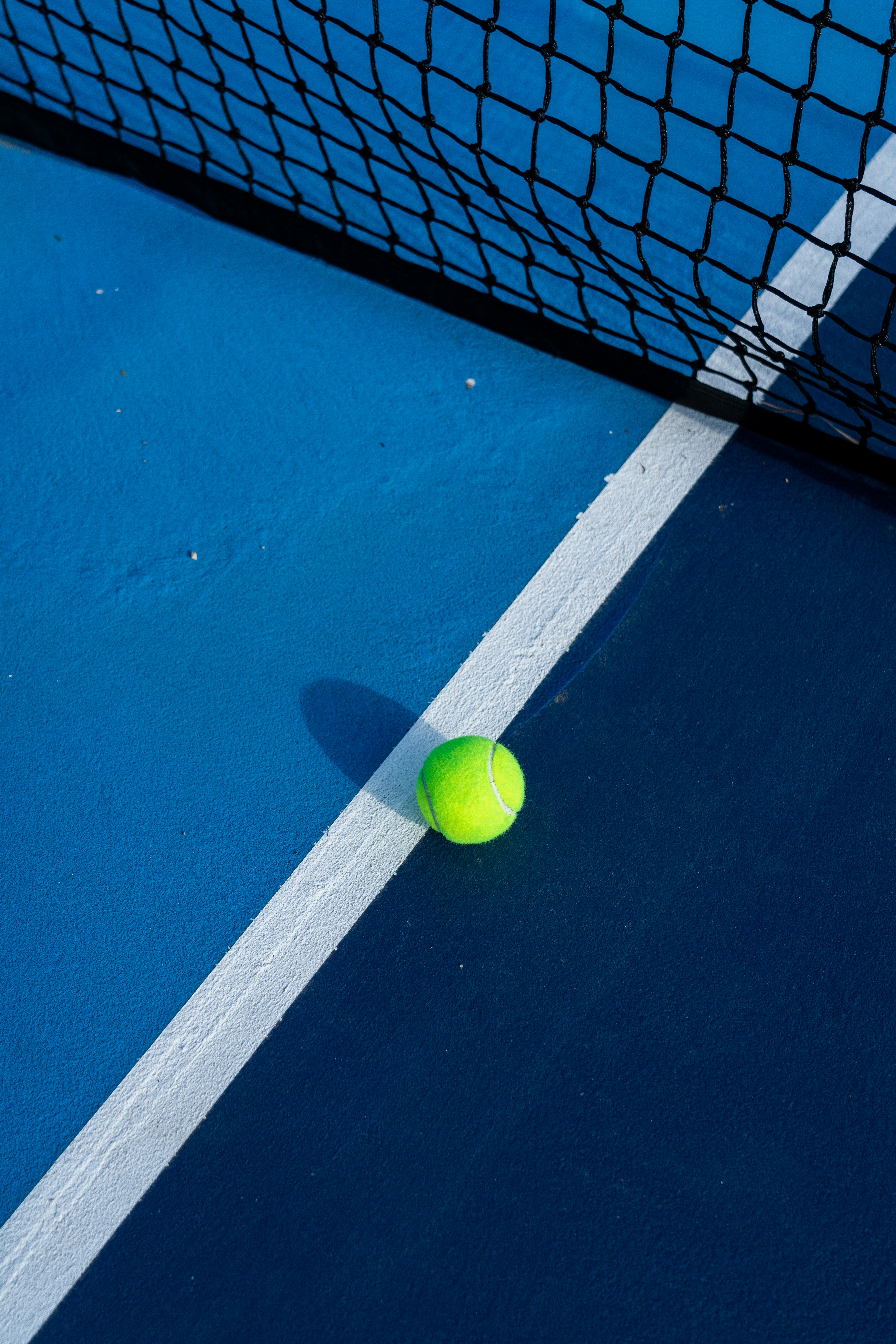 Players warming up on a floodlit padel court